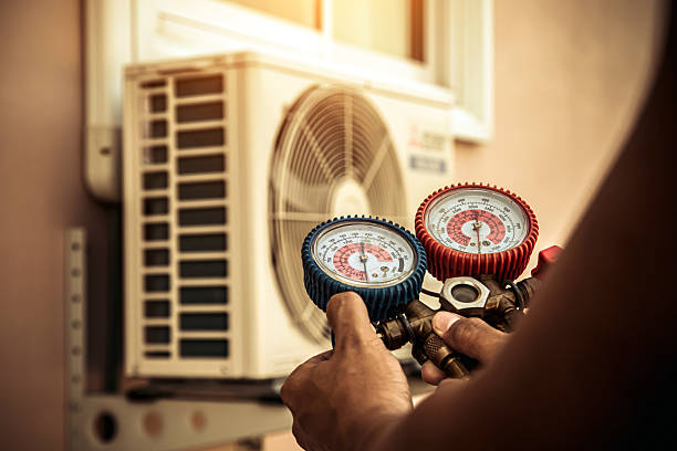 Professional Air Conditioning Service technician working in Louisville, CO